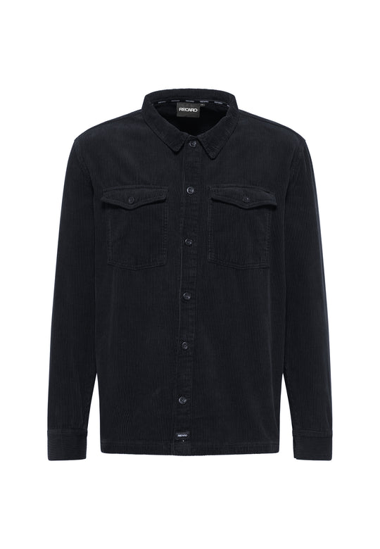 Die Hemdjacke Cord Originals von Recaro ist ein langärmliges schwarzes Cordhemd aus hochwertigem Stoff mit Kragen, Button-Down-Front und zwei Brusttaschen mit Patte – ein echtes Heritage-Stück.