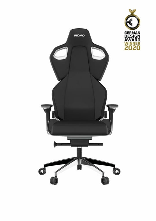 Der RECARO Exo Platinum aus dem RECARO Gaming ist ein schwarzer ergonomischer Gaming-Stuhl mit hoher Rückenlehne, Kopfstütze, kantigem Design, Spezialrollen und verstellbaren Armlehnen. In der Ecke prangt ein Badge des German Design Award Winner 2020.