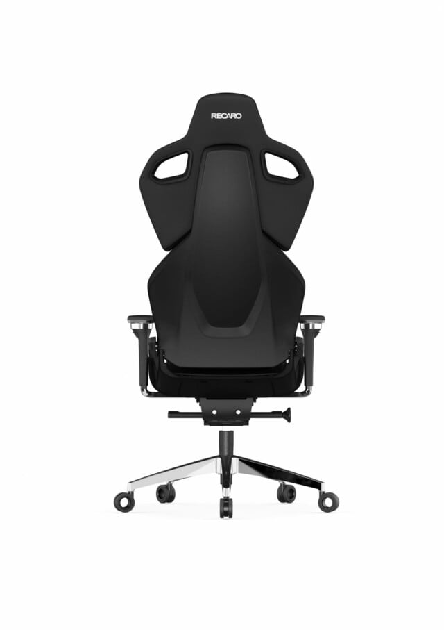 Der RECARO Shop Exo Platinum ist ein schwarzer ergonomischer Bürostuhl mit hoher Rückenlehne, Kopfstütze und Armlehnen. Er steht auf einem fünfrädrigen Metallfußgestell mit Spezialrollen. Das RECARO-Logo ist oben angebracht.