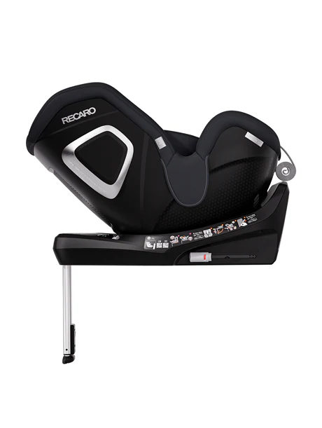 Seitenansicht des schwarzen RECARO Shop TORON 1 Kindersitzes im ergonomischen Design mit silbernen Akzenten, stabilisierendem Stützfuß und Sicherheitshinweis-Symbolen an der Basis.