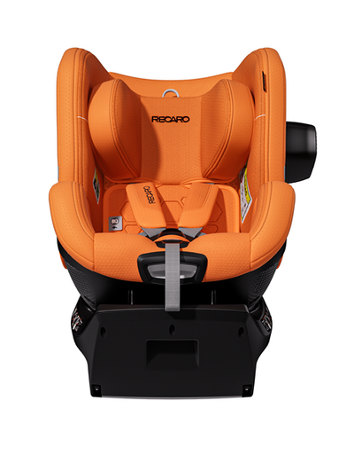 Der TORON 1 KID von RECARO Shop ist hier von vorne in Orange zu sehen, mit schwarzem Sockel und schwarzen Gurten. Der Kindersitz wurde für die Sicherheit und den Komfort des Kindes entwickelt und verfügt über gepolsterte Seitenwangen und eine Kopfstütze sowie eine 360°-Drehfunktion für zusätzlichen Komfort und einfache Handhabung.