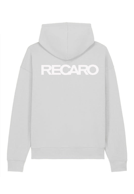 Der Hoodie RECARO Heavy Cotton aus dem RECARO Shop ist ein übergroßer, hellgrauer Kapuzenpullover mit dem RECARO Logo in kräftigem Weiß auf dem oberen Rücken. Er ist aus hochwertiger, ringgesponnener Baumwolle gefertigt, die für ein weiches, angenehmes Tragegefühl sorgt.